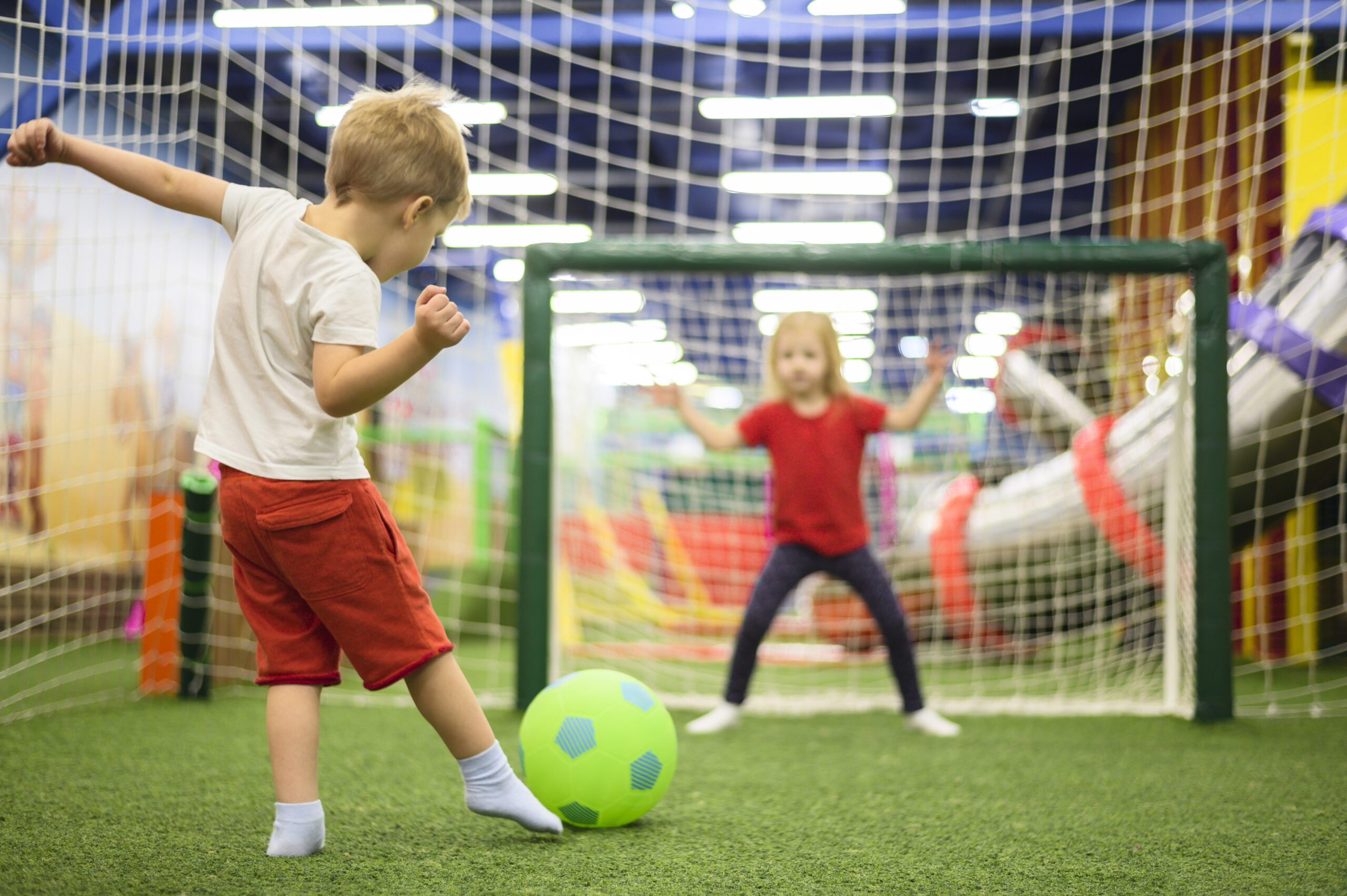 full-shot-boy-kicking-ball